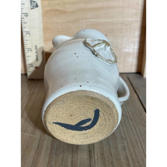 Small Pottery Pitcher with handle. 5" tall. Sand dollar? Signed. - Picture 4 of 4